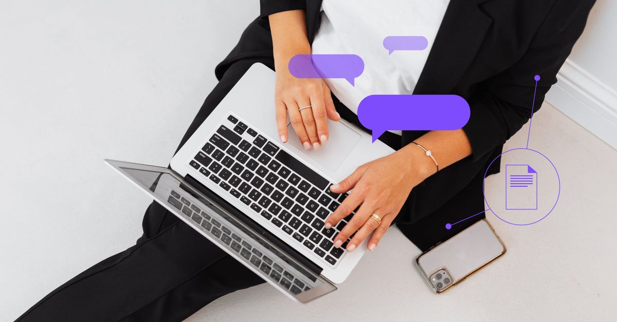 Woman in a black suit typing on a laptop, seen from above, with purple chat bubble graphics